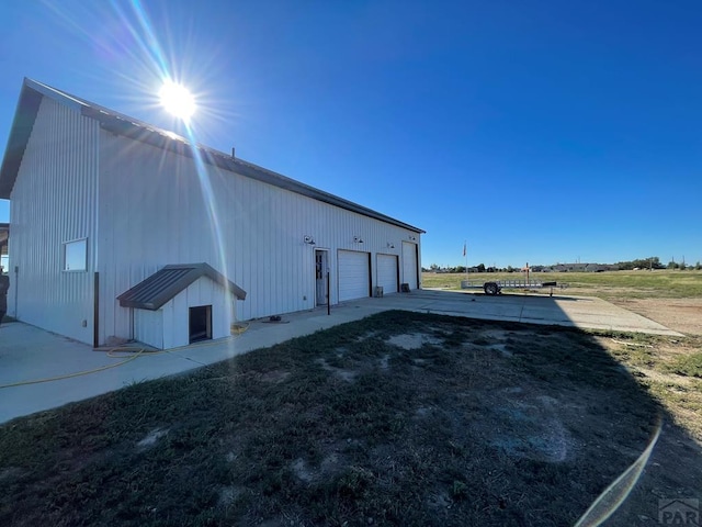 view of side of property featuring a garage