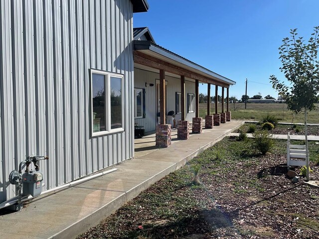 view of property exterior with a porch