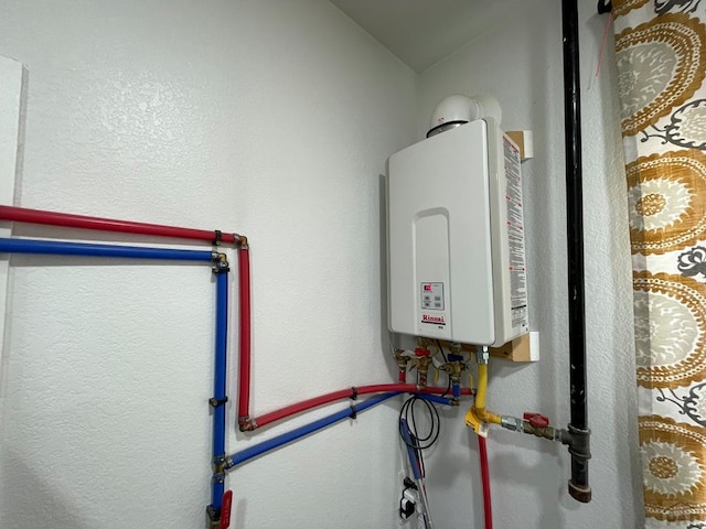 utility room with water heater