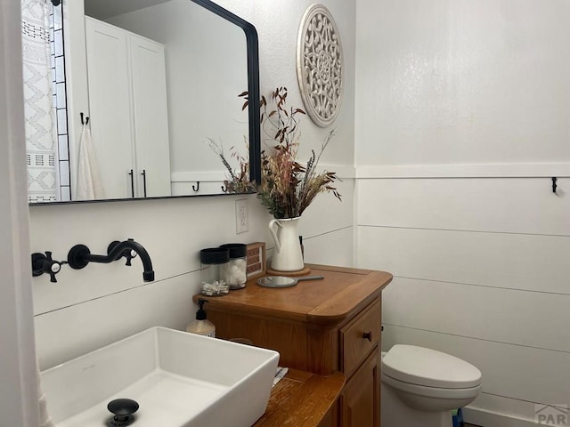 bathroom featuring toilet and a sink