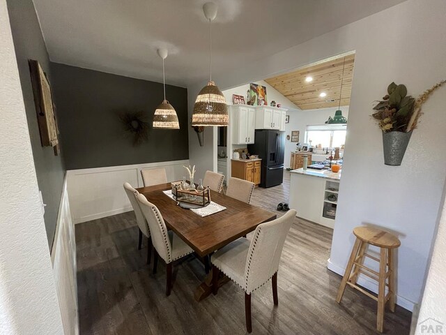 dining area featuring lofted ceiling, wooden ceiling, wood finished floors, and recessed lighting