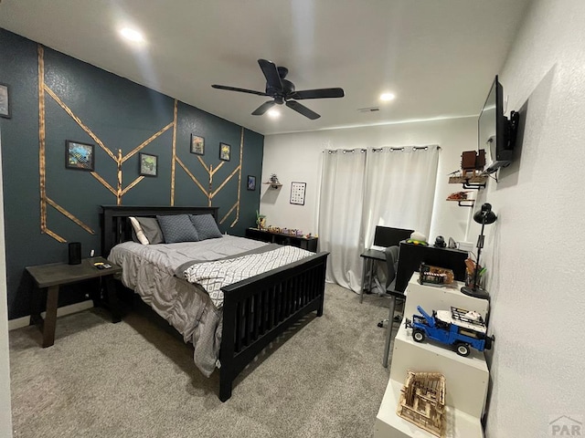 carpeted bedroom featuring visible vents and ceiling fan