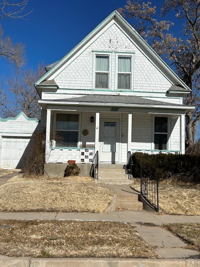 view of front of property with a garage and covered porch