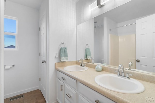 2200 Meadowlark Ln, Pueblo, CO 81008 - full bath with a shower, visible vents, a sink, and double vanity