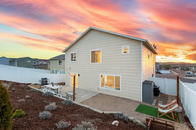 2200 Meadowlark Ln, Pueblo, CO 81008 - back of property featuring a fenced backyard, an outdoor structure, a storage shed, and a patio