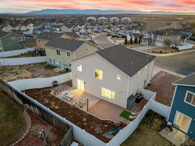 2200 Meadowlark Ln, Pueblo, CO 81008 - aerial view at dusk with a mountain view and a residential view