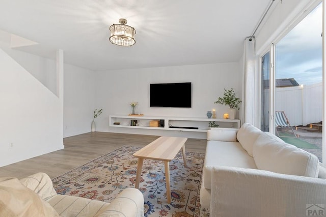 2200 Meadowlark Ln, Pueblo, CO 81008 - living room with a chandelier and wood finished floors