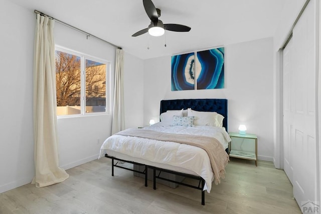 2200 Meadowlark Ln, Pueblo, CO 81008 - bedroom with a ceiling fan, baseboards, light wood-style floors, and a closet