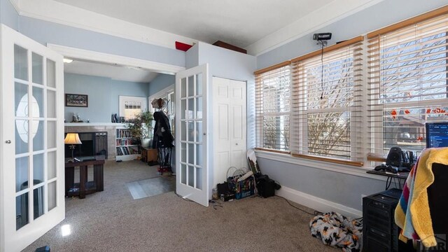 carpeted home office with baseboards and french doors