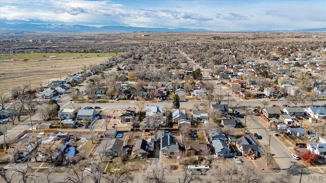 birds eye view of property with a residential view and a mountain view