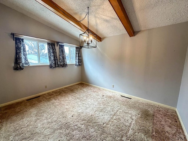 spare room featuring carpet floors, visible vents, lofted ceiling with beams, and a textured ceiling