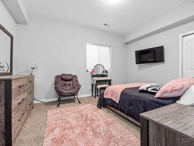 bedroom featuring light colored carpet, baseboards, and visible vents