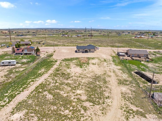 birds eye view of property featuring a rural view