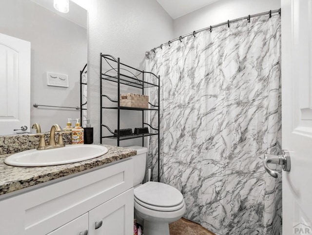 full bathroom with toilet, curtained shower, and vanity
