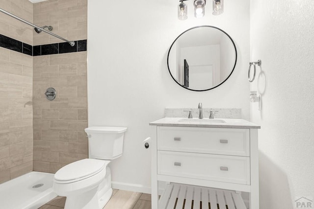 1090 E Linda Ave, Pueblo West, CO 81007 - full bath featuring a tile shower, vanity, toilet, and baseboards