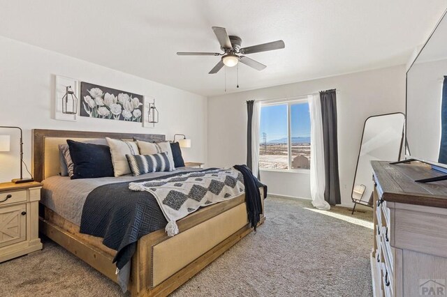 carpeted bedroom featuring ceiling fan