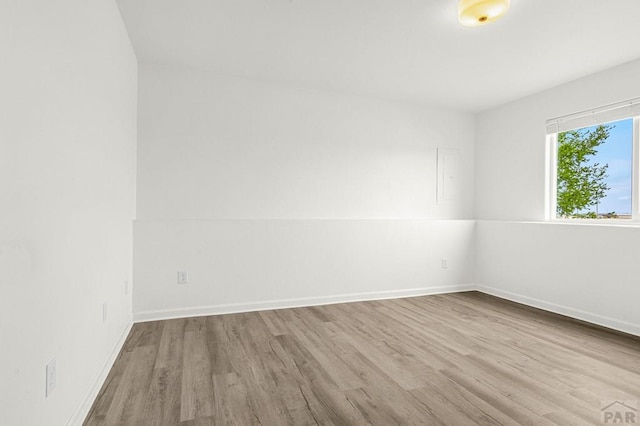 1090 E Linda Ave, Pueblo West, CO 81007 - spare room featuring wood finished floors and baseboards