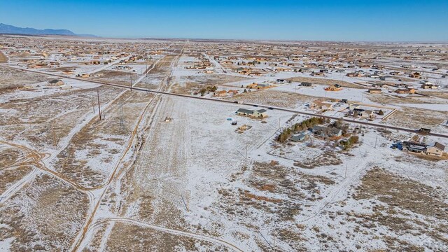 drone / aerial view with a residential view and a mountain view