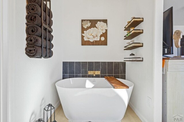 bathroom with a freestanding tub