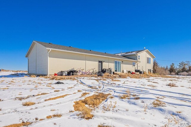 view of snow covered house