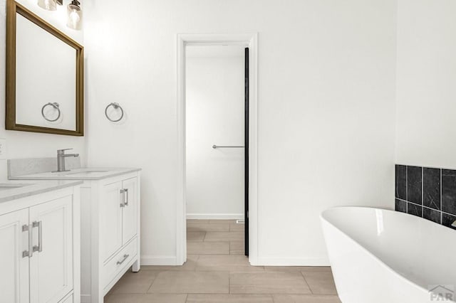 1090 E Linda Ave, Pueblo West, CO 81007 - full bath with baseboards, a freestanding tub, and vanity