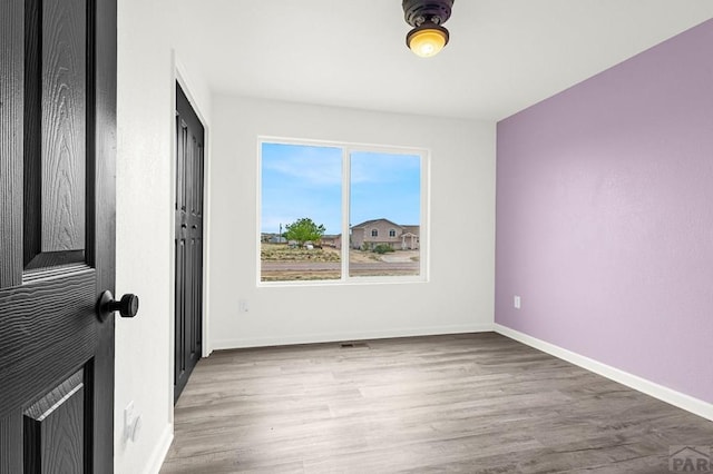 1090 E Linda Ave, Pueblo West, CO 81007 - spare room with wood finished floors and baseboards