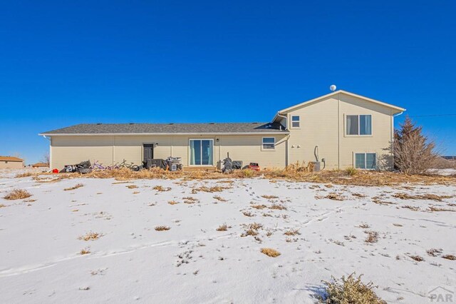 view of snow covered property