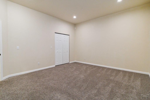 unfurnished room featuring recessed lighting, carpet flooring, and baseboards