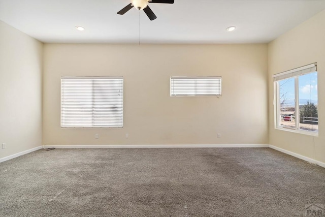 carpeted spare room with a ceiling fan, recessed lighting, and baseboards