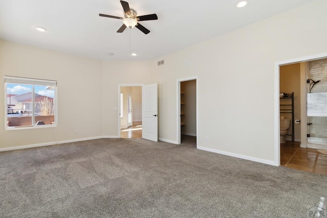 unfurnished bedroom with carpet floors, recessed lighting, visible vents, and a spacious closet