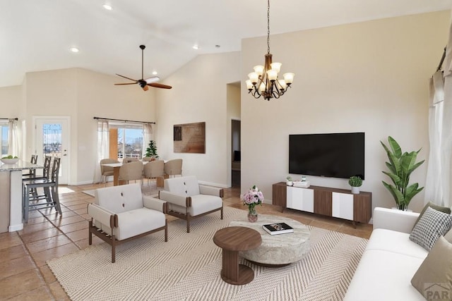 living room featuring high vaulted ceiling, recessed lighting, baseboards, and ceiling fan with notable chandelier