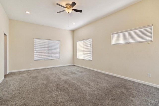 spare room with carpet, ceiling fan, baseboards, and recessed lighting