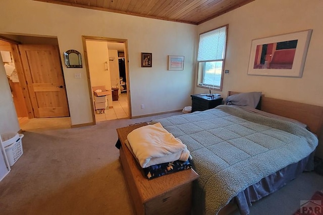 bedroom with carpet flooring, baseboards, and wood ceiling