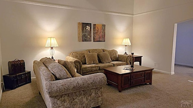 carpeted living room with baseboards