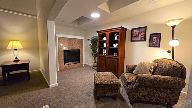 interior space featuring recessed lighting, a tile fireplace, and baseboards