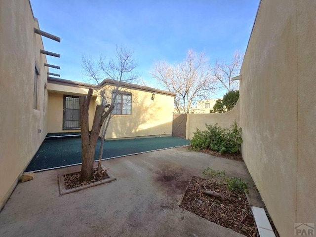 view of property exterior with fence