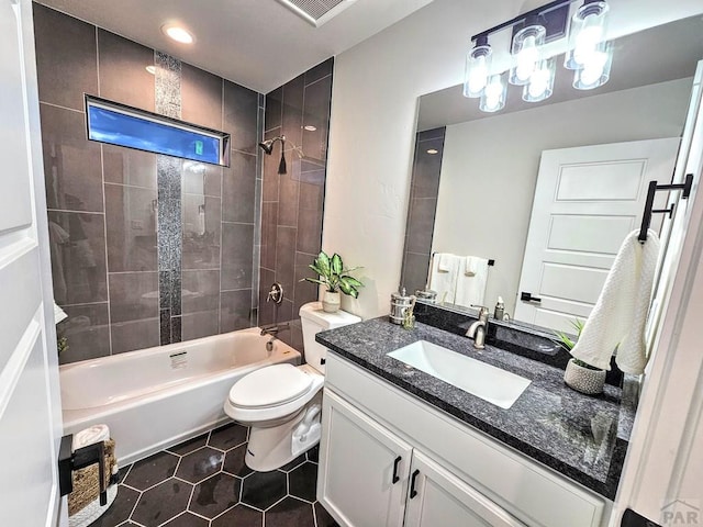 full bathroom with visible vents, toilet, shower / washtub combination, tile patterned flooring, and vanity