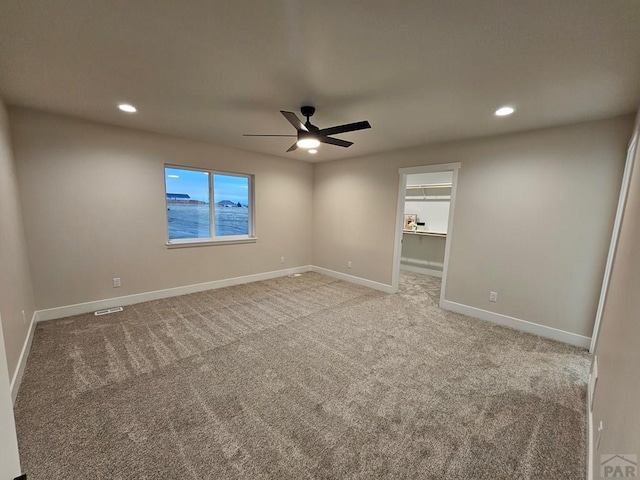 unfurnished room with visible vents, light carpet, recessed lighting, baseboards, and ceiling fan