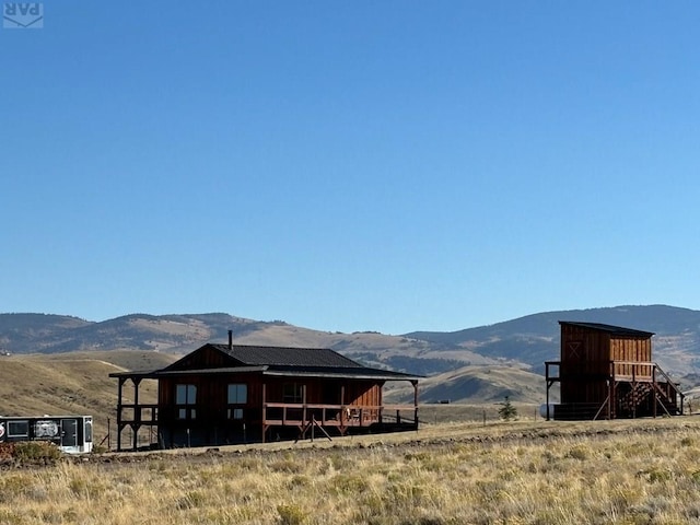 property view of mountains featuring a rural view