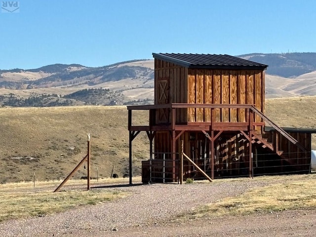 exterior space with a mountain view and a rural view