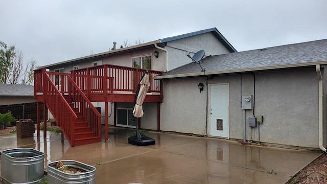 270 W Baldwyn Dr, Pueblo West, CO 81007 - rear view of house featuring a patio, stairs, a wooden deck, and stucco siding