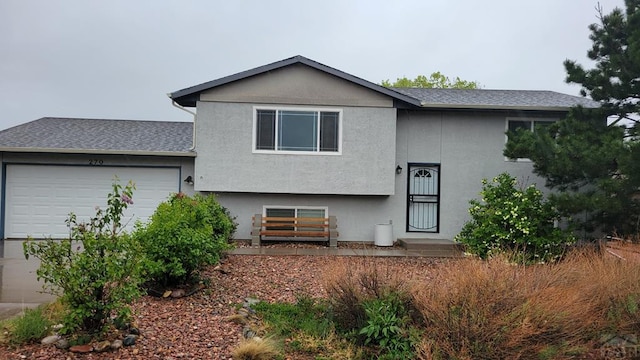 270 W Baldwyn Dr, Pueblo West, CO 81007 - view of front facade with an attached garage and stucco siding
