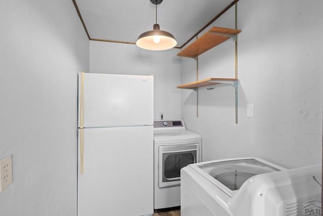 laundry room featuring laundry area and washing machine and dryer