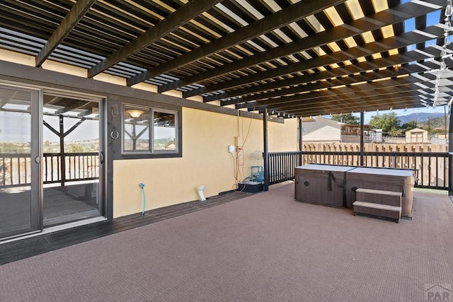 view of patio with a pergola and a hot tub