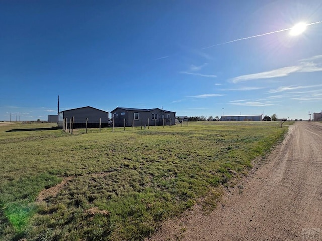 256 E First St, Hasty, CO 81044 - view of yard featuring a rural view and fence