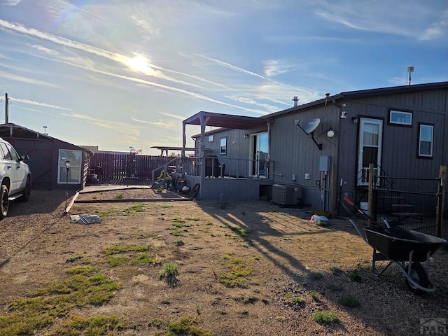 256 E First St, Hasty, CO 81044 - view of yard featuring central air condition unit and fence