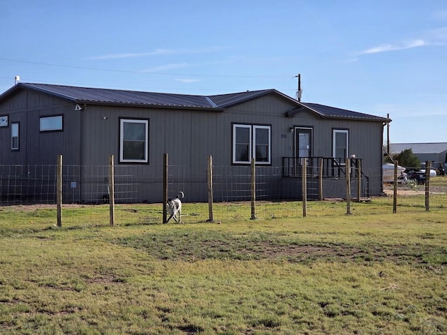 256 E First St, Hasty, CO 81044 - exterior space featuring fence, metal roof, and a front yard