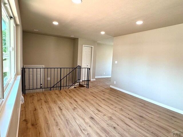 3923 Lancaster Dr, Pueblo, CO 81005 - spare room featuring wood finished floors and recessed lighting