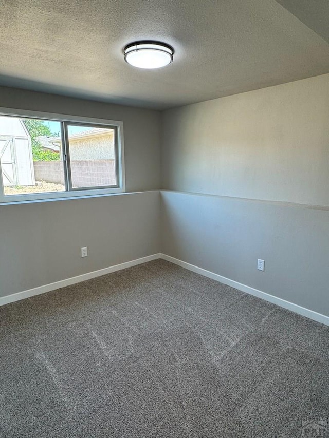 3923 Lancaster Dr, Pueblo, CO 81005 - carpeted spare room featuring a textured ceiling and baseboards