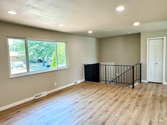 3923 Lancaster Dr, Pueblo, CO 81005 - empty room featuring wood finished floors and recessed lighting